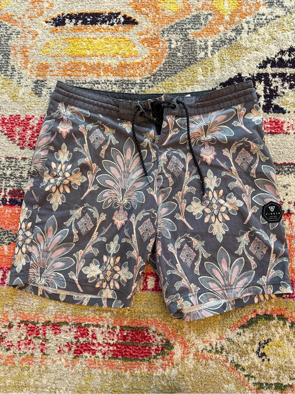 VISSLA Black Swim Trunks with Pastel Floral Accents